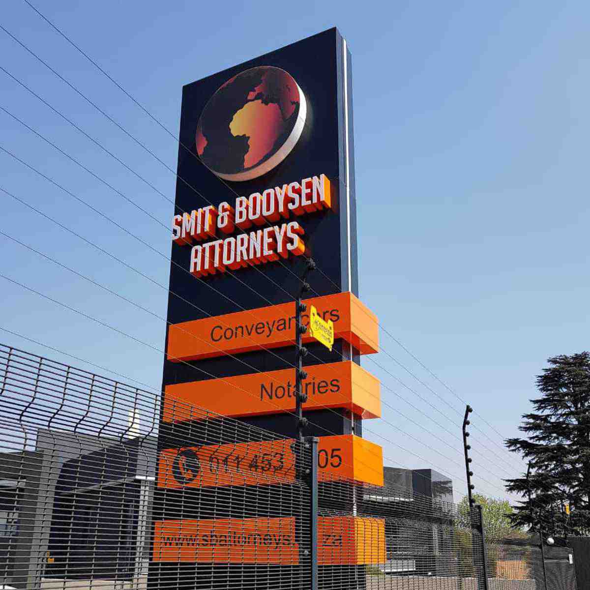 Entrance pylon sign advertising professional business services